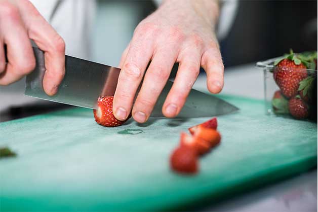 Chef slicing the strawberries