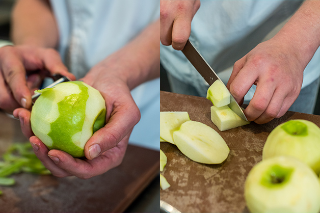 The picture shows the chef peeling and cutting the apples