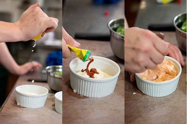 The chef is seen combining ingredients for the mayonnaise sauce