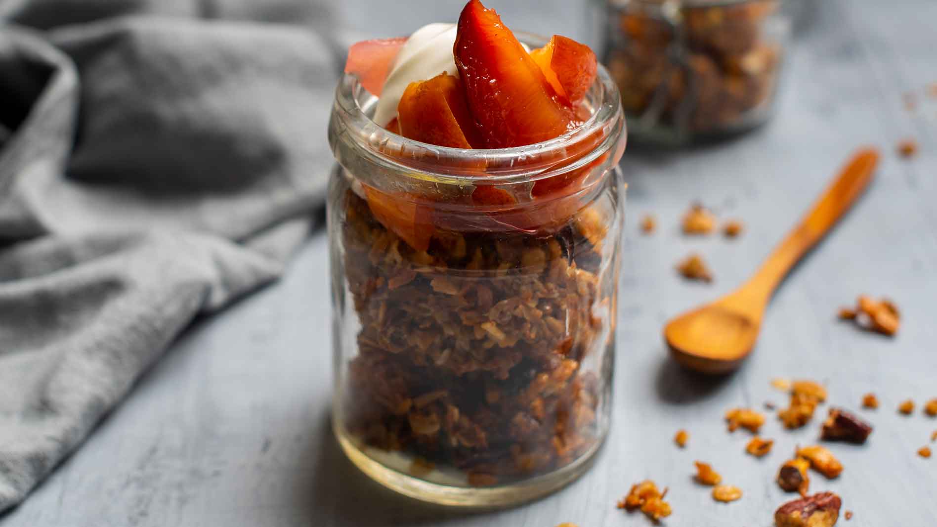 Homemade granola with honey and poached fruits