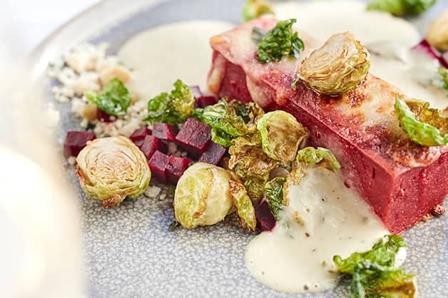 Baked beetroot roman gnocchi, smoked scamorza, brussels sprout crisps, marjoram, macadamia crumble, burnt butter cream V