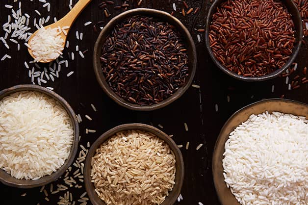 The photo is of five different types of rice