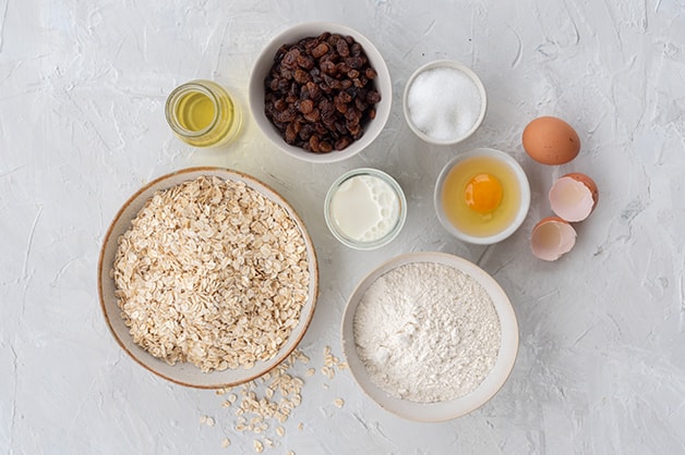 Raw ingredients for the oat and sultana muffins are shown in this image