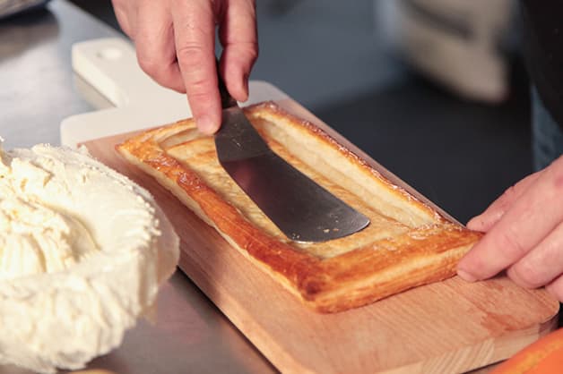 The chef is seen pushing down the Pampas Puff Pastry
