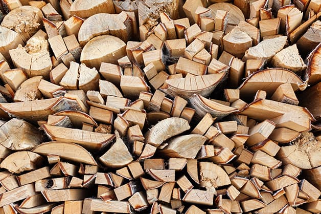 Image shows a pile of wood