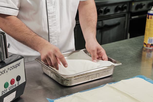 Lining a baking tray with Pampas Filo Pastry