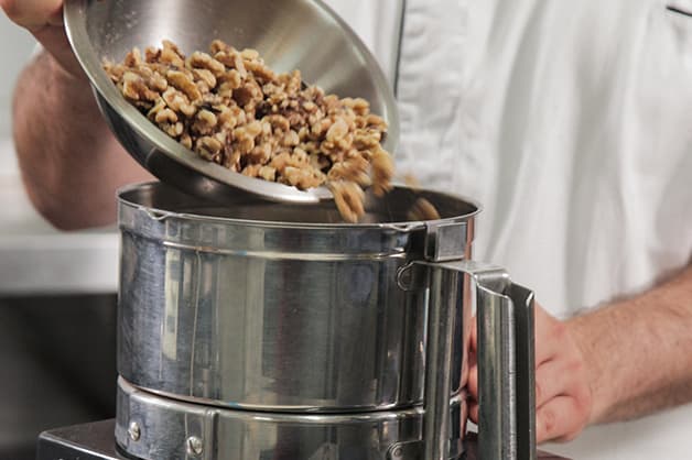 Placing nuts in a food processor