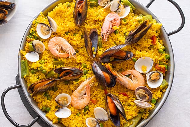 Image is of a dish of paella